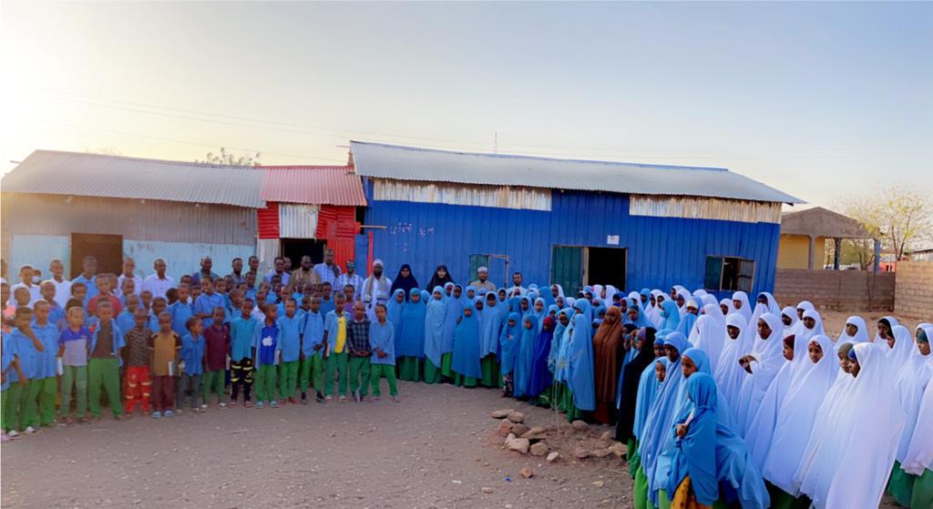 Students standing together outside the school.