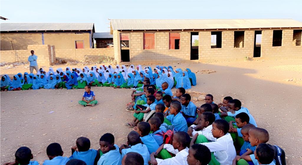 Students gathered for an outdoor school activity.